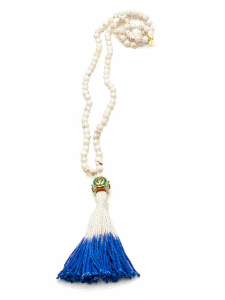 white howlite 108 bead mala necklace with a Tibetan prayer bead and a royal blue and white tassel