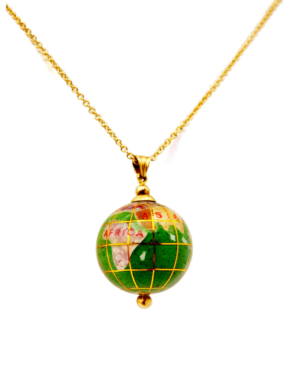Gold and green enamel globe pendant on gold chain.